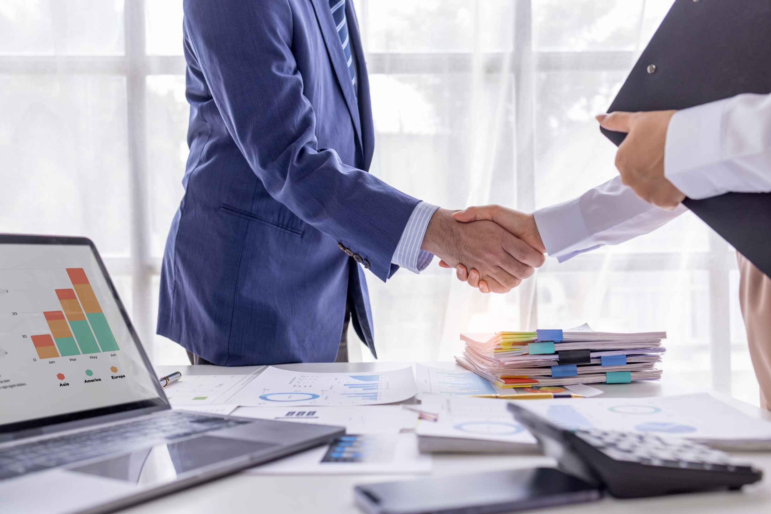 Entrepreneurs discussing the benefits of a private limited company in a modern office